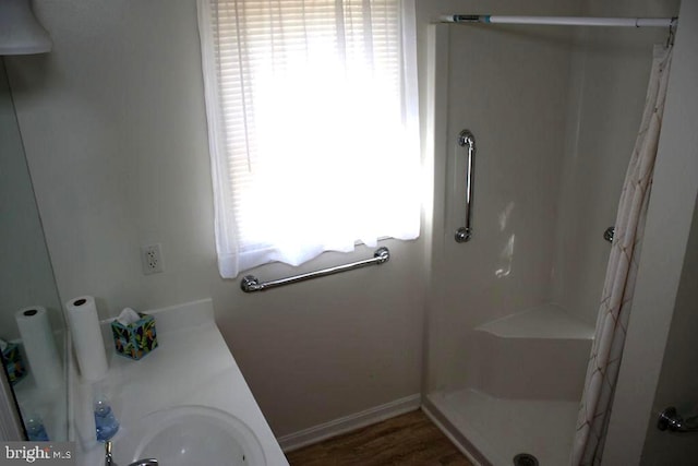 bathroom featuring a shower with curtain and sink