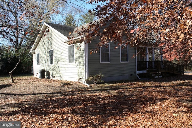 view of side of home featuring central air condition unit