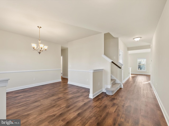 interior space with dark hardwood / wood-style flooring and an inviting chandelier