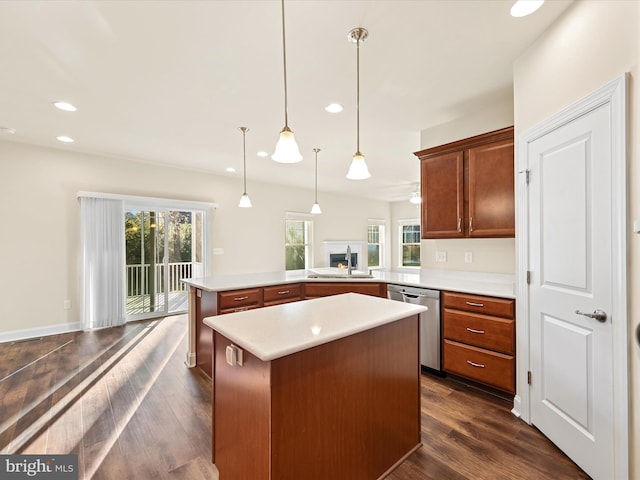 kitchen featuring dark wood-type flooring, a center island, stainless steel dishwasher, and sink