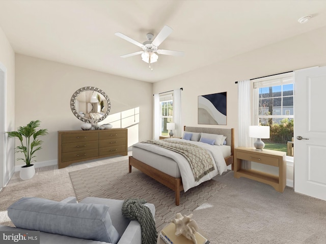 carpeted bedroom with ceiling fan and multiple windows