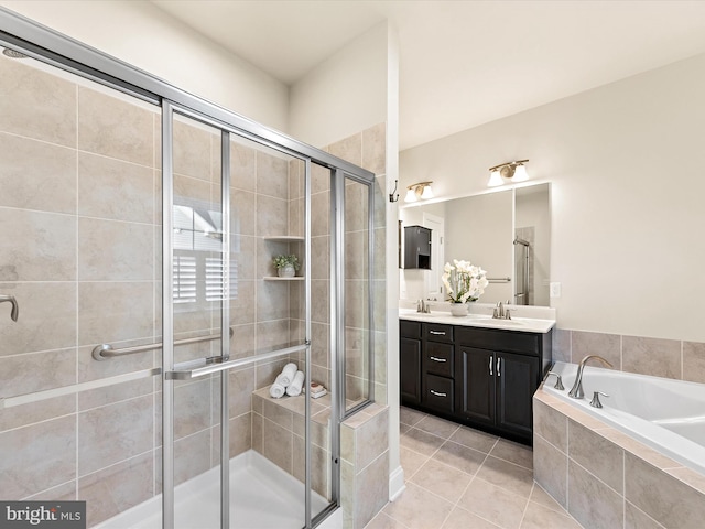 bathroom featuring tile patterned flooring, vanity, and separate shower and tub