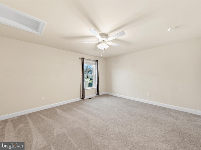 unfurnished room featuring light carpet and ceiling fan