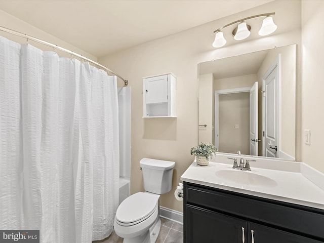 full bathroom with tile patterned floors, shower / bath combo with shower curtain, vanity, and toilet