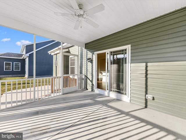 view of patio with ceiling fan and a porch