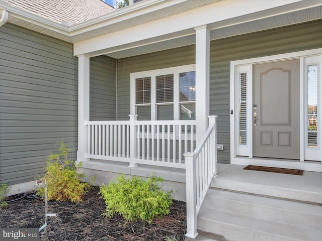 doorway to property featuring a porch