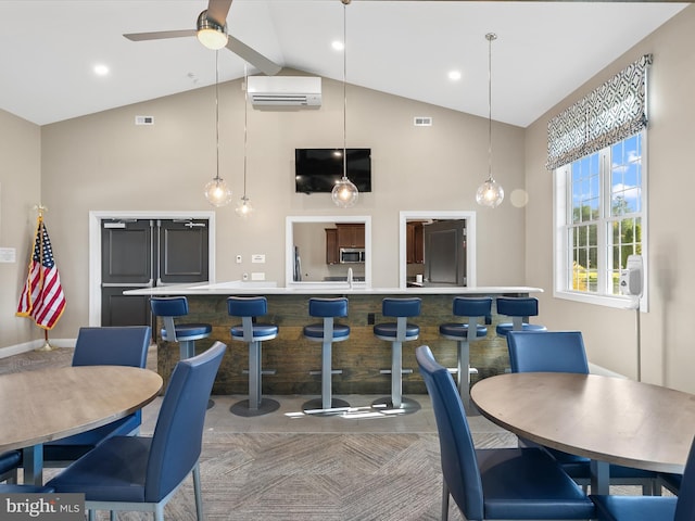 dining area featuring high vaulted ceiling, ceiling fan, sink, and a wall unit AC