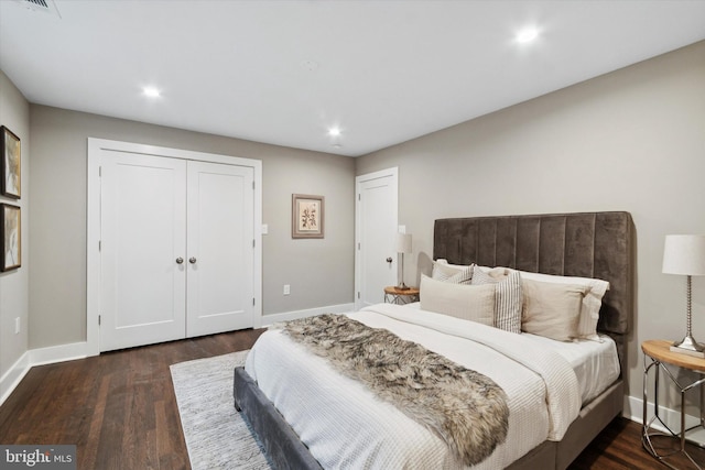 bedroom featuring a closet and dark wood-type flooring