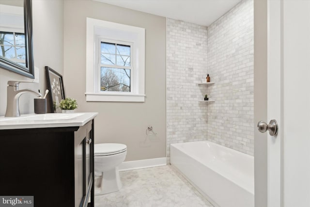 full bathroom featuring tile patterned flooring, vanity, toilet, and tiled shower / bath