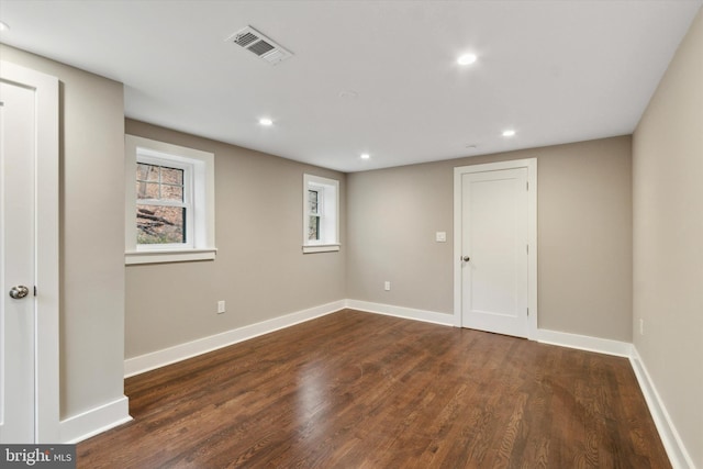 unfurnished room featuring dark hardwood / wood-style floors