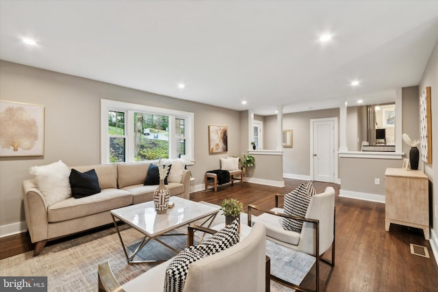 living room featuring dark wood-type flooring