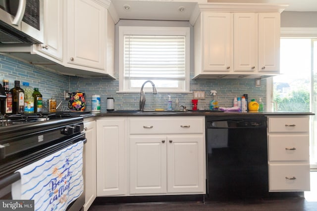 4504 Harbor Beach Blvd, Brigantine, NJ 08203 - kitchen featuring dishwasher, stainless steel microwave, a sink, stove, and dark countertops