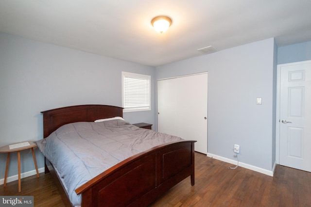 4504 Harbor Beach Blvd, Brigantine, NJ 08203 - bedroom featuring dark wood-type flooring, baseboards, and a closet