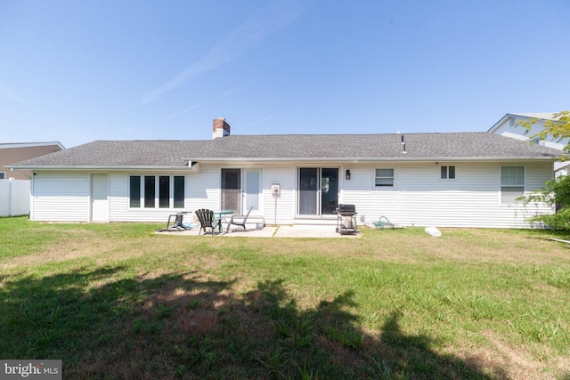 4504 Harbor Beach Blvd, Brigantine, NJ 08203 - back of property featuring a yard, a patio area, and a chimney