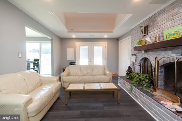 4504 Harbor Beach Blvd, Brigantine, NJ 08203 - living area featuring a raised ceiling, wood finished floors, french doors, a brick fireplace, and ornamental molding