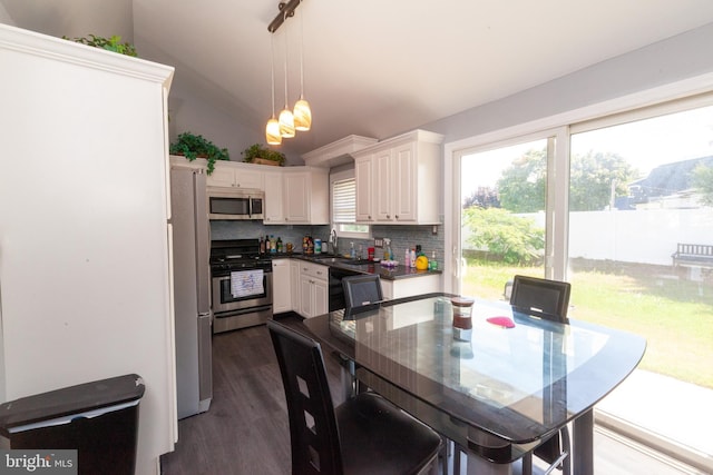 4504 Harbor Beach Blvd, Brigantine, NJ 08203 - dining area with dark wood-style floors and vaulted ceiling