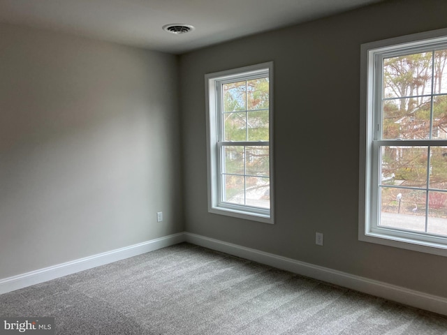 spare room featuring carpet