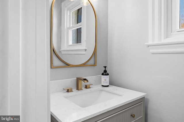 bathroom with vanity and a wealth of natural light