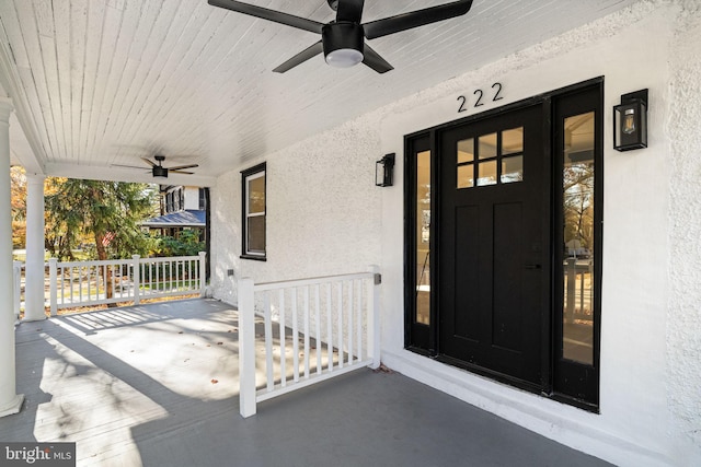 view of exterior entry with a porch