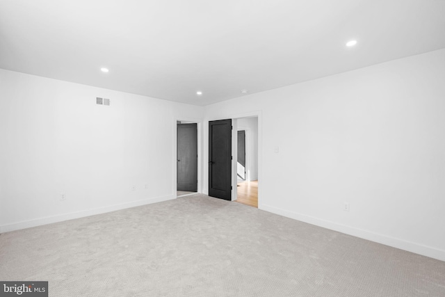 empty room with light colored carpet