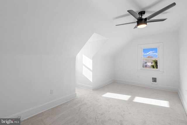 bonus room with light carpet, ceiling fan, and lofted ceiling