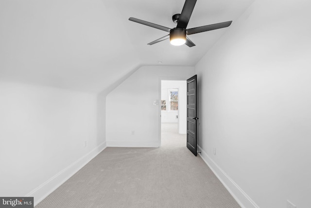 bonus room featuring light carpet, vaulted ceiling, and ceiling fan