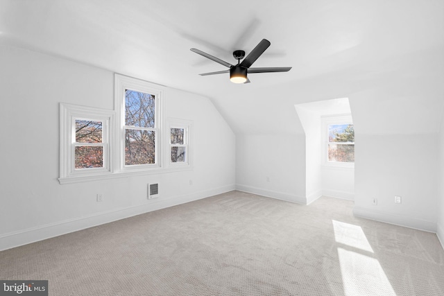 bonus room featuring light colored carpet, ceiling fan, and lofted ceiling