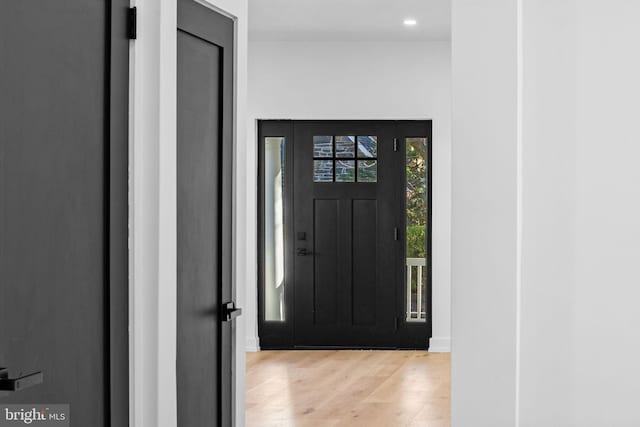 foyer entrance with light wood-type flooring