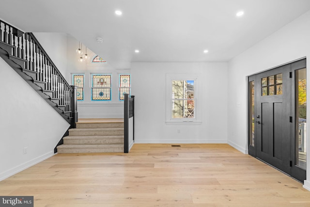 foyer with light wood-type flooring