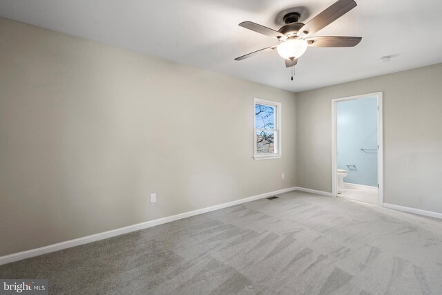 empty room with light carpet and ceiling fan