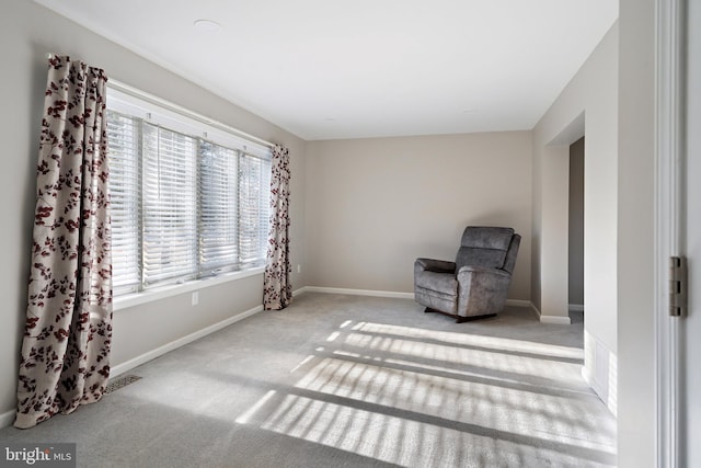 unfurnished room with light carpet