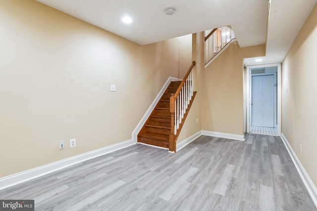 stairs with hardwood / wood-style floors