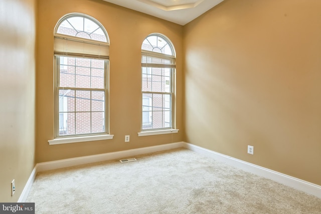 unfurnished room featuring carpet