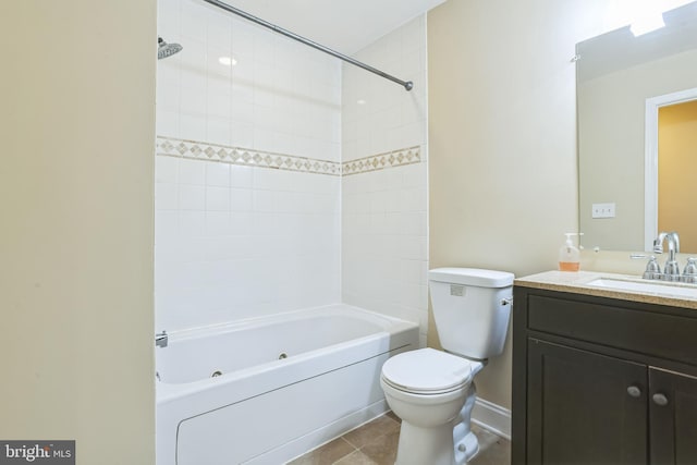 full bathroom with tile patterned flooring, vanity, toilet, and tiled shower / bath