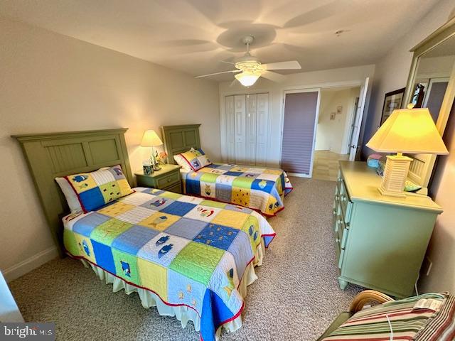 carpeted bedroom featuring ceiling fan