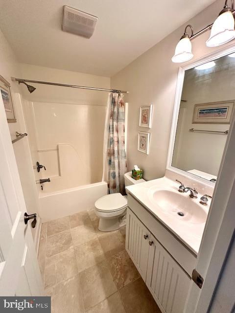 full bathroom with vanity, shower / bathtub combination with curtain, and toilet