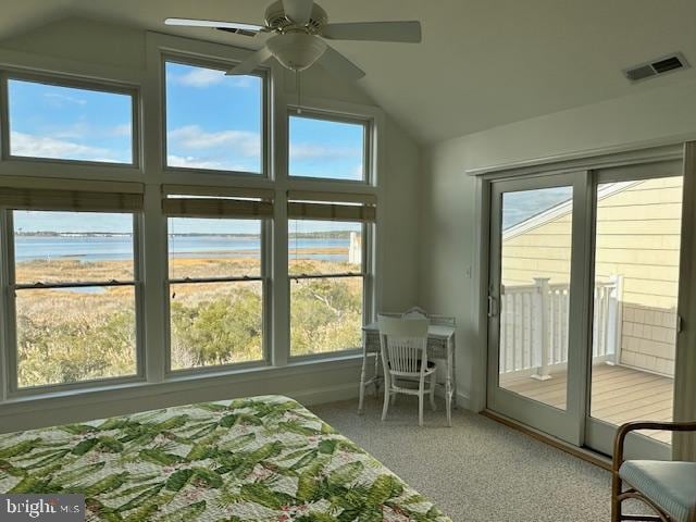 bedroom with access to exterior, carpet, a water view, and multiple windows