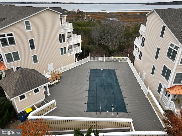 view of swimming pool with a water view