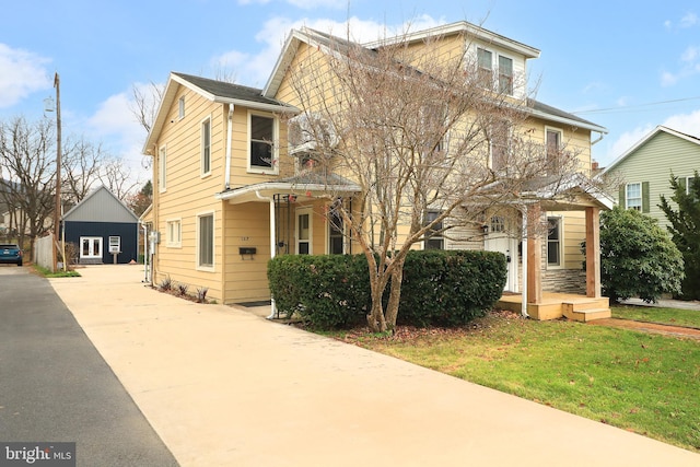 view of property with a front lawn