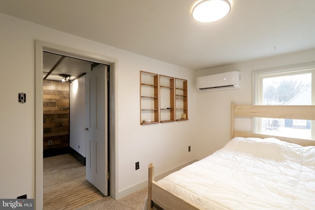 bedroom featuring a wall unit AC