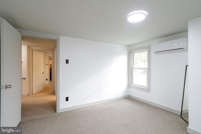 carpeted empty room featuring a wall unit AC