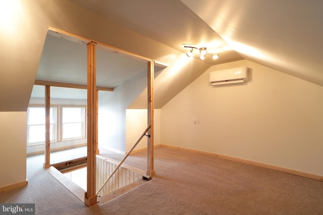 additional living space with carpet flooring, a wall unit AC, and vaulted ceiling