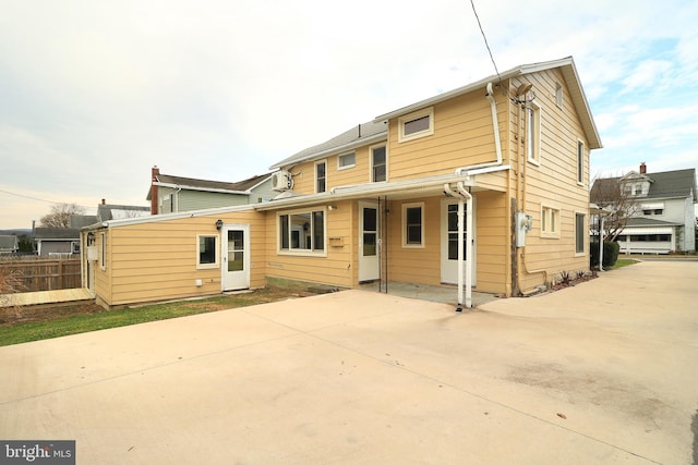 rear view of property with a patio area