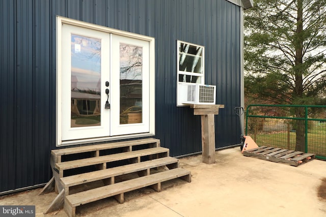 view of outbuilding featuring cooling unit and french doors