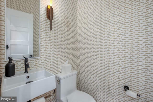 bathroom with sink and toilet