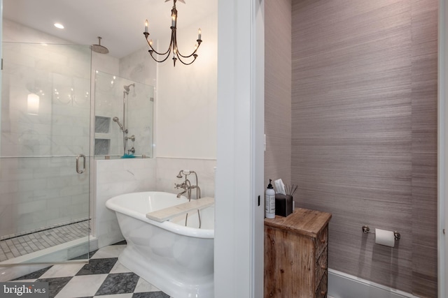 bathroom with a notable chandelier, tile walls, and independent shower and bath