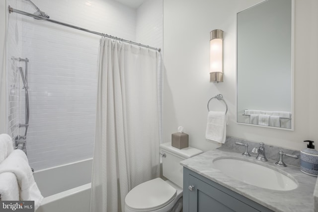 full bathroom with vanity, shower / bath combination with curtain, and toilet