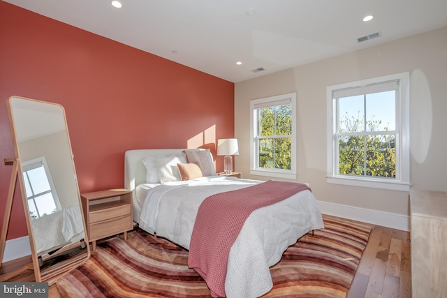 bedroom with light hardwood / wood-style floors