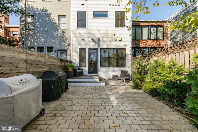 rear view of house with a patio