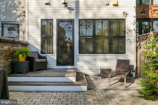 entrance to property with a patio